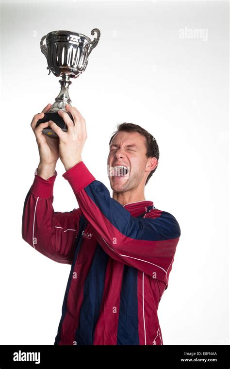 Football Player Lifting Trophy Stock Photo Alamy