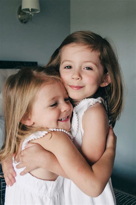 Two Little Sisters Hugging