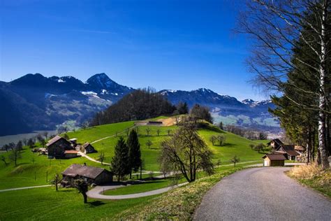 4k 5k Schwyz Switzerland Mountains Roads Grasslands Houses