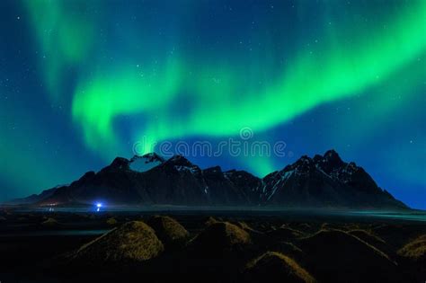 Northern Light Aurora Borealis At Vestrahorn Mountains In Stokksnes