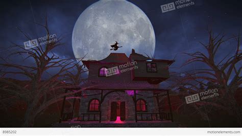 Halloween Witch Flying Over A Haunted House On A Broom Footage Stock