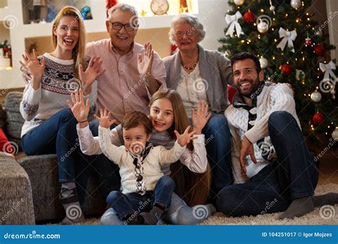 Children With Parents And Grandparents Celebrating Christmas Stock