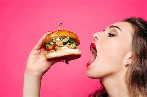 Premium Photo Hungry Girl With Opened Mouth Eating Big Hamburger