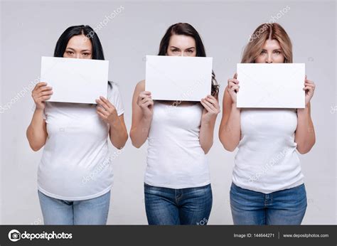Women Holding Up White Signs — Stock Photo © Dmyrtoz 144644271