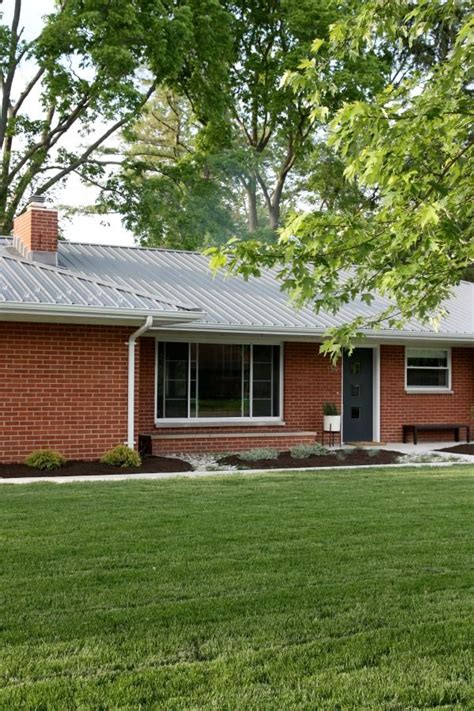 There are so many colorful options available that it's easy to get wowed by the prospect of something other than the traditional charcoal. red brick (like ours) + metal roof + charcoal door ...