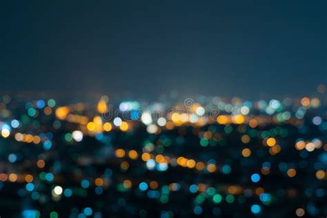 Bokeh Background Of Skyscraper Buildings In Downtown City With Lights
