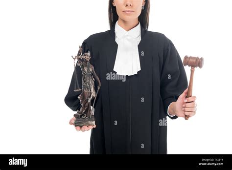 Partial View Of Judge In Judicial Robe Holding Gavel And Themis Figurine Isolated On White Stock