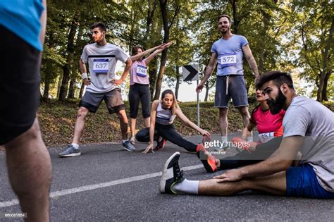 Marathon Runners Warming Up On The Road Before The Race High Res Stock