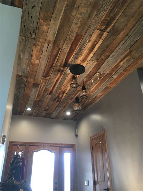 By using wood that's had a past life, you get all the charm. Entryway rustic ceiling remodel | Barn wood walls bedroom ...
