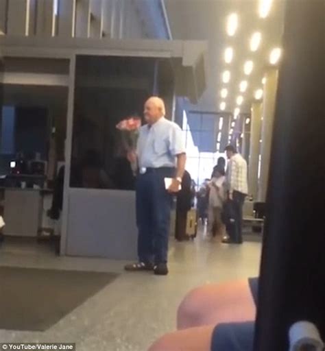 old man filmed surprising his wife with flowers at airport has gone viral on facebook daily
