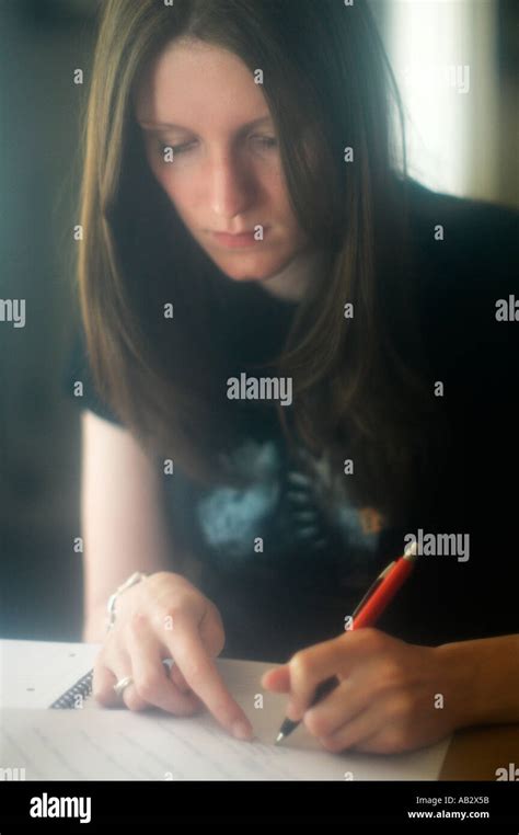 Writing A Young Left Handed Woman Writing Stock Photo Alamy
