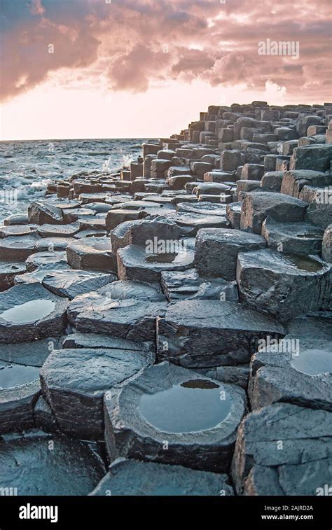 Sunset With The Giants Causeway In The Foreground Stock Photo Alamy