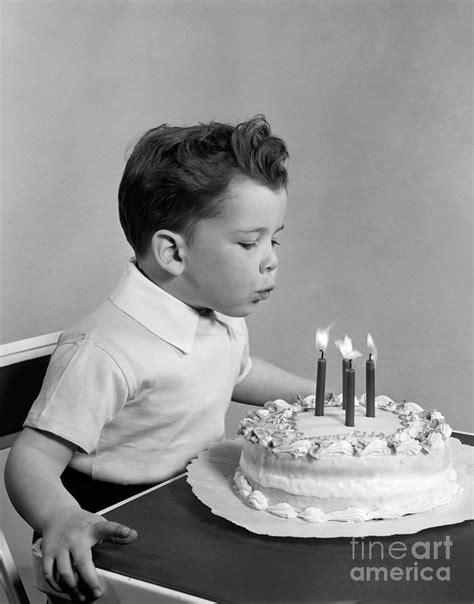 Boy Blowing Out Candles On Cake C1950s Photograph By H Armstrong