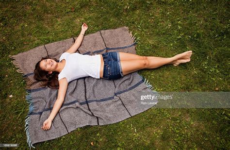 Teen Girl Lying On A Blanket High Res Stock Photo Getty Images