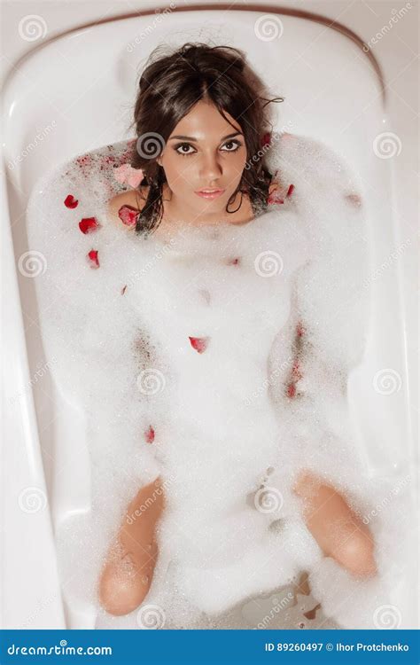 Girl Lying In A Bubble Bath With Rose Petals Stock Image Image Of
