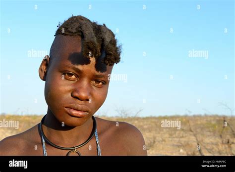 Portrait Of Himba Girl With The Typical Double Plait Hairstyle Of The