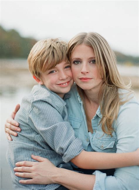 mother and son sitting together and hugging by stocksy contributor marta locklear stocksy