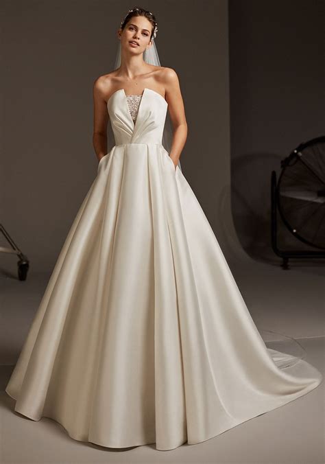 White formal dresses are perfect for galas, weddings and more. Pronovias Phoebe Wedding Dress, Off White | McElhinneys