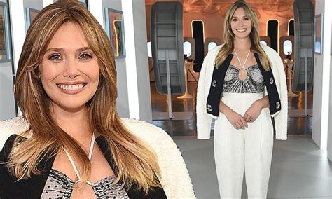 Elizabeth Olsen Flashes The Flesh In Peekaboo Top As She Poses Up At