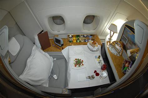 Emirates' a380 first class cabin is on the upper deck, and consists of a total of 14 seats — there are four rows of single seats on each side of the cabin, and then three sets of two seats in the center of the cabin. The Emirates A380 First Class Cabin: One Indulgent Experience