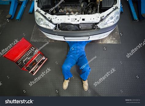 Mechanic Lying Working Under Car Repair Stock Photo Edit Now 249165616