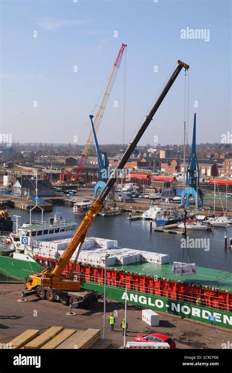 Timber Ship Being Unloaded Stock Photo Alamy