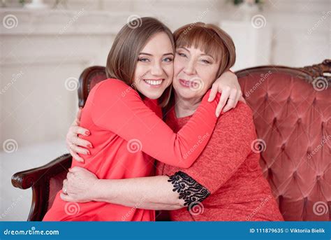 Mature Mother And Daughter Hugging Stock Image Image Of Mature Home 111879635