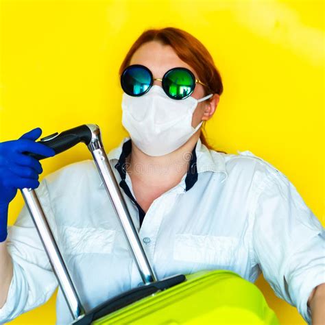 Portrait Of A Girl In Face Mask Medical Mask And Sunglasses On Yellow