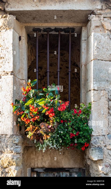 Stone Window Recess With Flowers And Security Bars Stock Photo Alamy