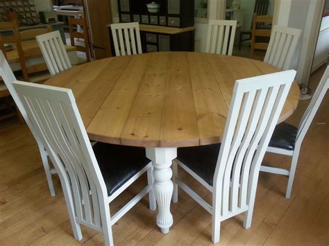 On the table vase of flowers. Perfect 8 Person Round Dining Table - HomesFeed