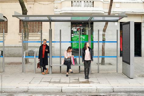People Waiting At A City Bus Stop Del Colaborador De Stocksy Ivan