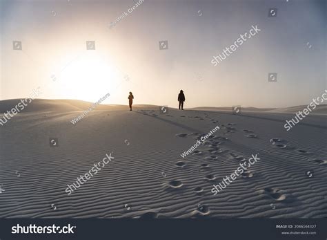 Silhouette People Walking Desert Leaving Footsteps Stock Photo Edit