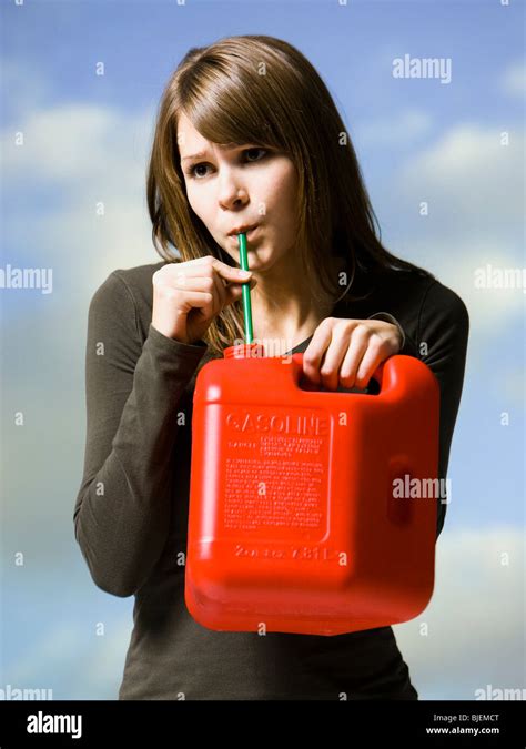 Woman Drinking Gasoline Stock Photo Alamy