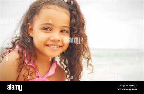 Cute Little Girl Smiles On A Beach Stock Video Footage Alamy