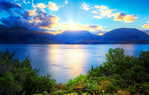 Mountains Lake Water Nature Green Clouds Sun Sky Phone Wallpapers