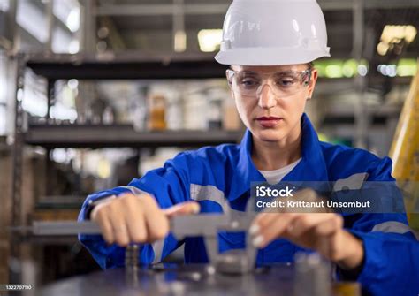 Quality Control Female Engineers Measure The Production Of Mechanical