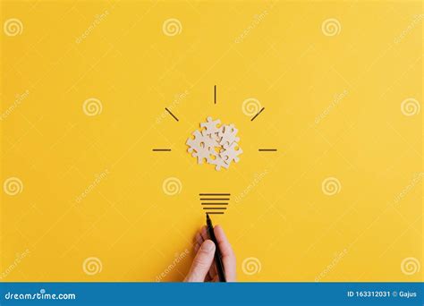 Light Bulb Over Yellow Background In Vision And Idea Conceptual Image