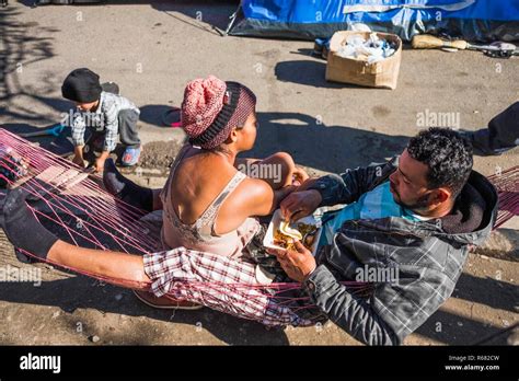 Members Of The Migrant Caravan Are Seen Resting In Makeshift Conditions As They Await For Asylum