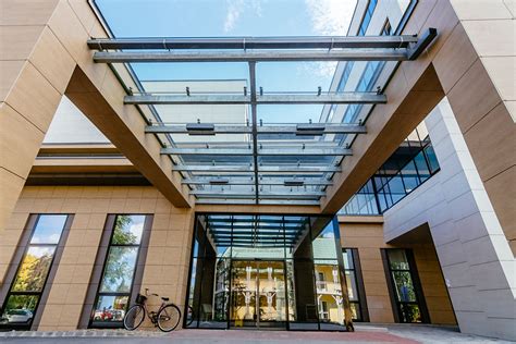 Glass canopy kit for doors and entrances, 4 point fixing system with all stainless steel fittings and toughened laminate glass canopy. Large glass canopy, Hospital - SADEV Architectural Systems