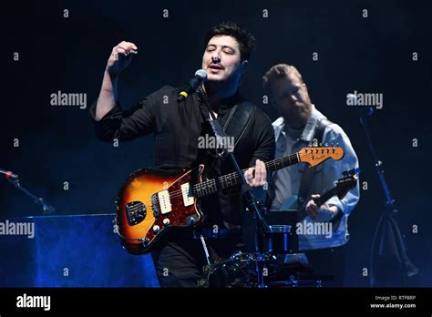Musician Marcus Mumford Is Shown Performing On Stage During A Live