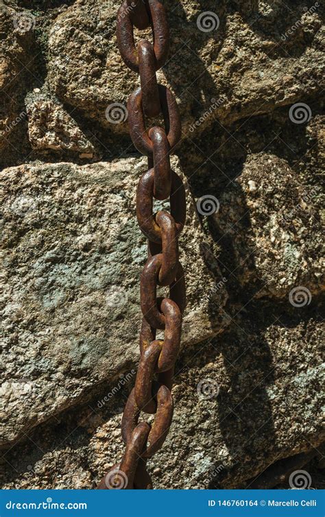 Iron Chain Stuck In A Stone Brick Wall Stock Photo Image Of Cityscape
