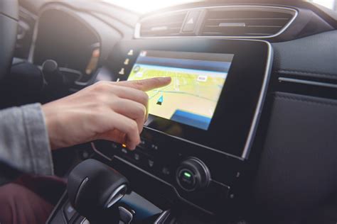 Hand Using Gps Navigation System In Car While Travel Stock Photo