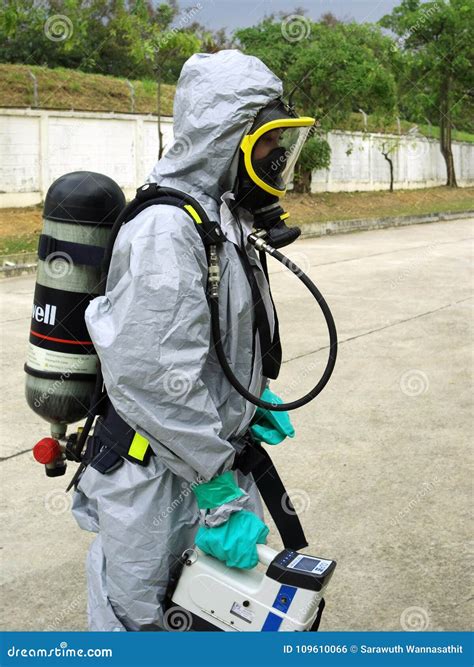 Emergency Team Wearing Chemical Protection Suit For Work In Dang