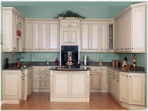 If cabinets feel very old and outdated, use faux finishes to enhance this look in a cool way. Antique White Kitchen Cabinets Lowes | Kitcheniac