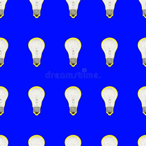 Seamless Pattern Of Light Bulbs On A Blue Color Stock Photo Image Of