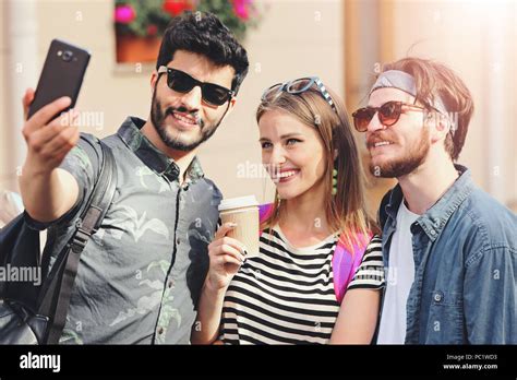 Three Multicultural Cute Best Friends In Sunglasses Taking Selfie At The Sunny Summer Street And