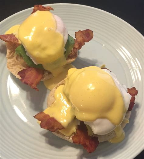 Eggs Benedict with bacon and avocado : food