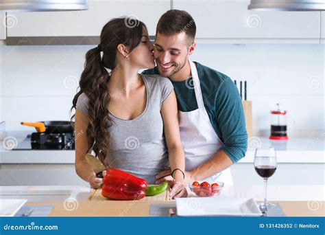 Beautiful Young Couple Having Romantic Moments Hugging And Kissing