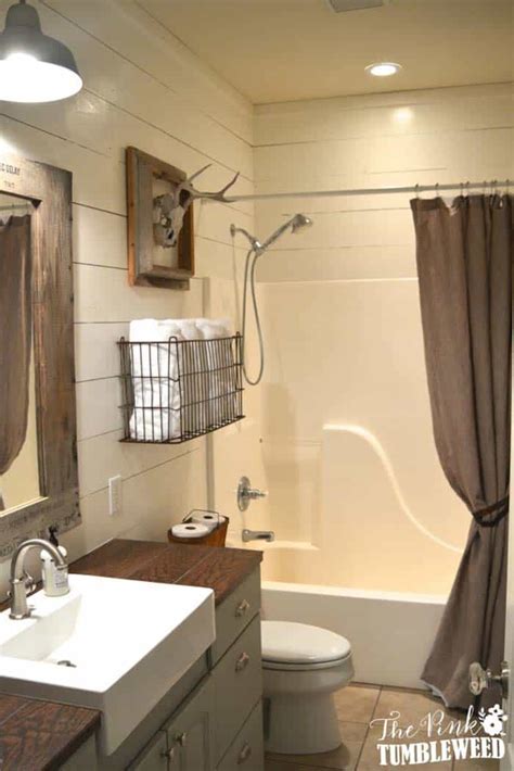 Farmhouse basket storage using rustic wire baskets or eco style woven baskets. 21 Gorgeous farmhouse style bathrooms you will love