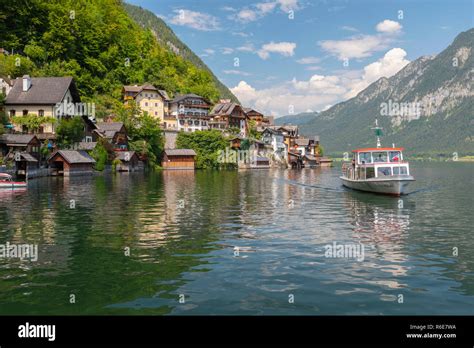 Tourists Lake Cruise Boat On Hallstattersee By The World Heritage